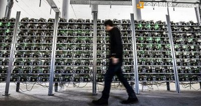 A large-scale Bitcoin mining farm with rows of ASIC miners in a cooled warehouse